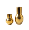 Two gold metallic vases on a white background