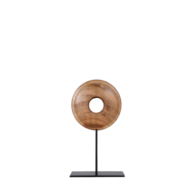 Wooden ring sculpture on a black stand.