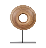 Wooden ring sculpture on a black stand.