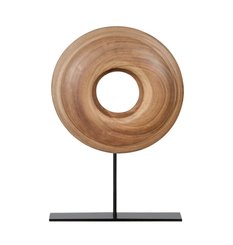Wooden ring sculpture on a black stand.