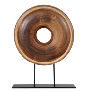 Wooden ring sculpture on a black stand.