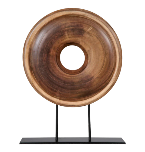 Wooden ring sculpture on a black stand.