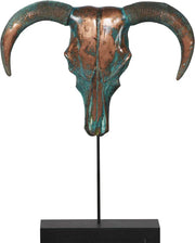 Decorative ram skull sculpture with green and brown hues on a black stand against a white background