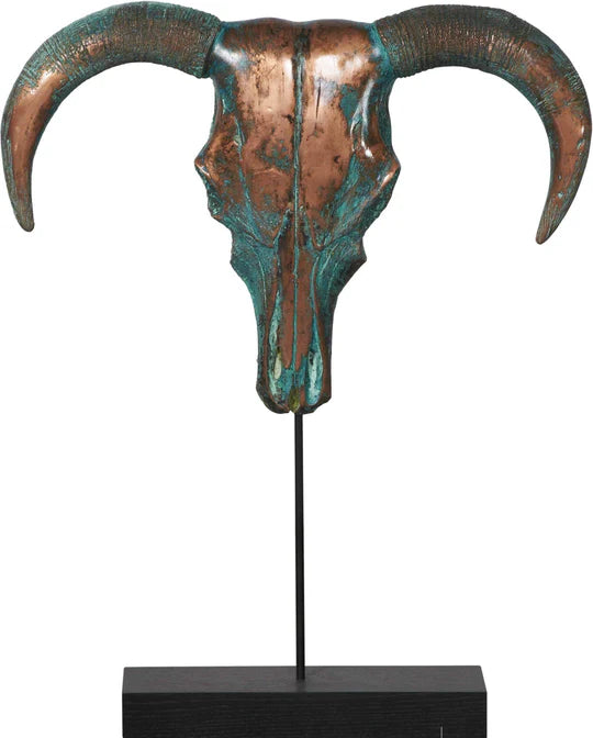 Decorative ram skull sculpture with green and brown hues on a black stand against a white background