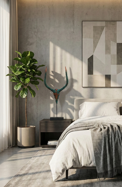 Modern bedroom with a bed, nightstand, and decorative elements.