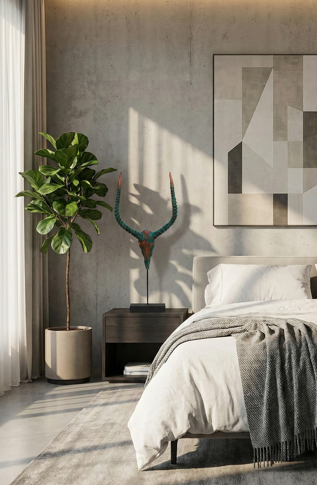 Modern bedroom with a bed, nightstand, and decorative elements.