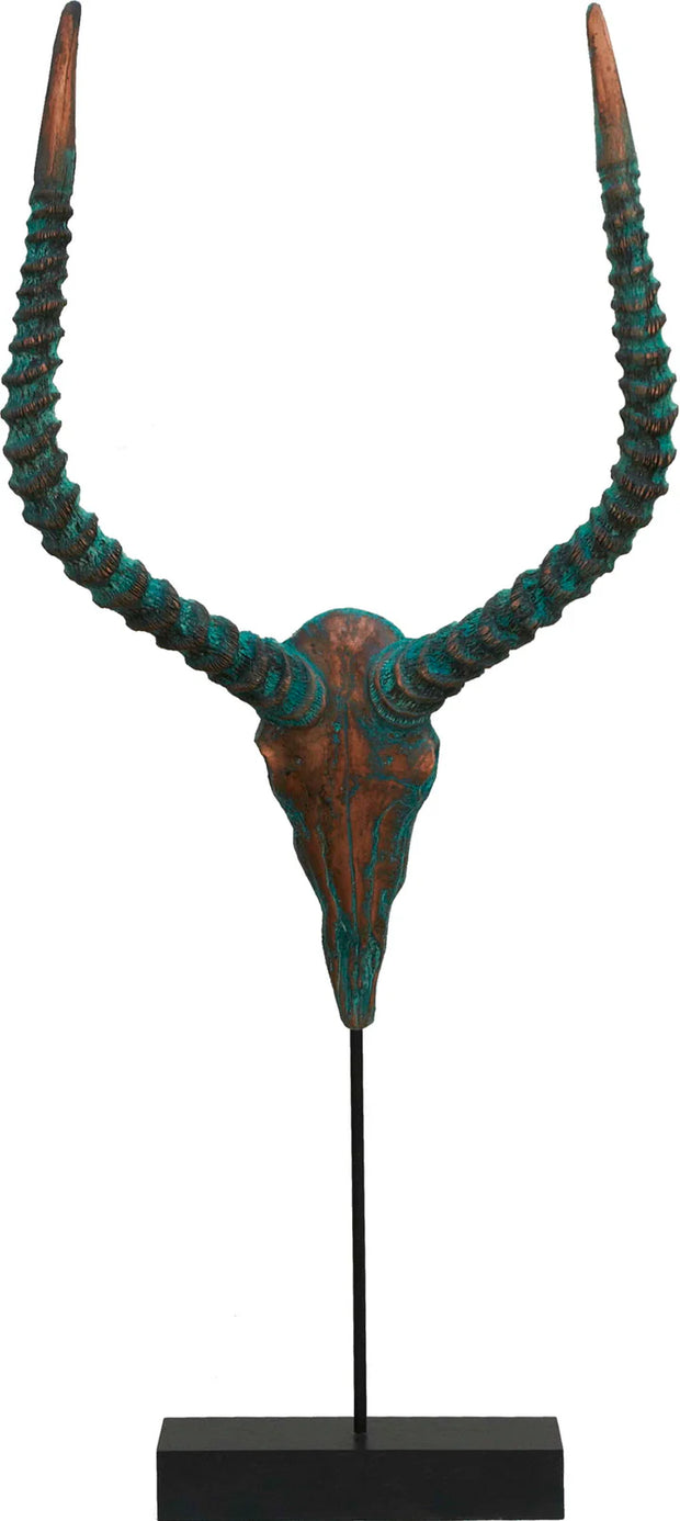 Decorative antelope horns with turquoise and brown coloration on a black stand against a white background.