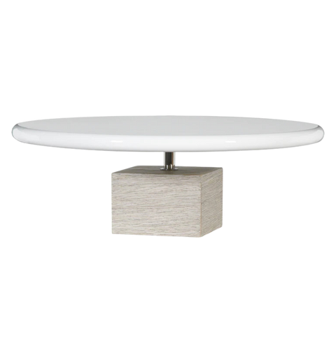 Round white table with a square base on a white background