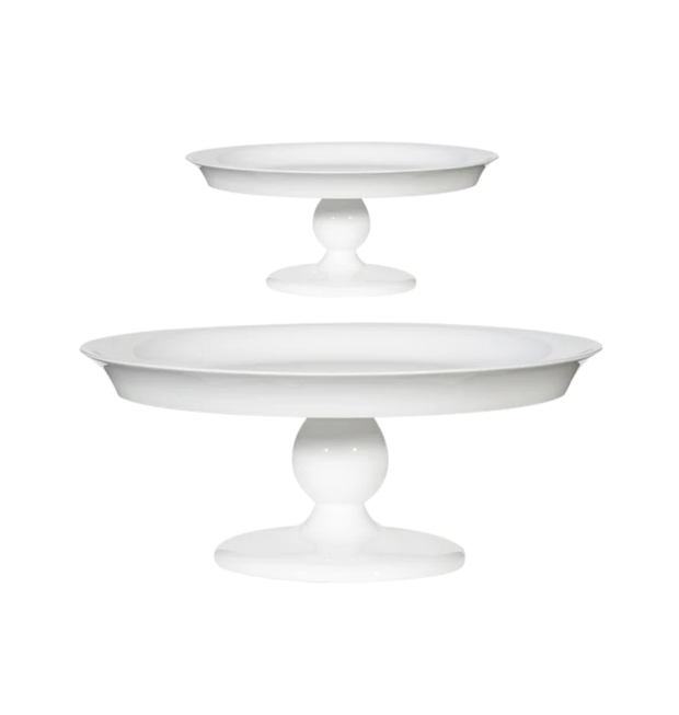Two white cake stands on a white background