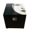Black box with a face design on a white background