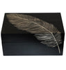 Black box with a carved feather on a white background
