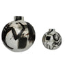 Two ceramic spherical vases with artistic designs on a white background