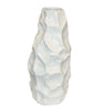 White ceramic vase with textured surface on a white background
