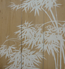 White bamboo leaves on a wooden panel background